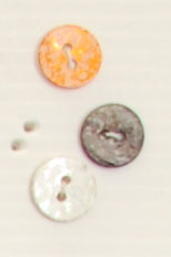 Bouton 2 trous (Nacre - Orange - 11 mm)